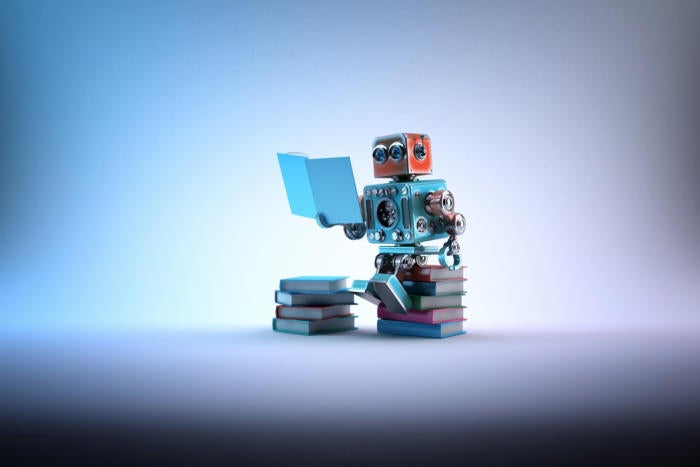 artificial intelligence / machine learning / robot reading stack of books