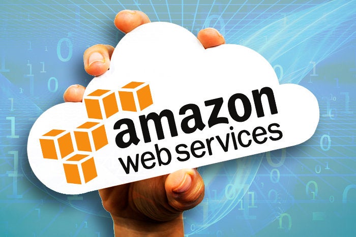 hand holding paper cloud for amazon web services logo