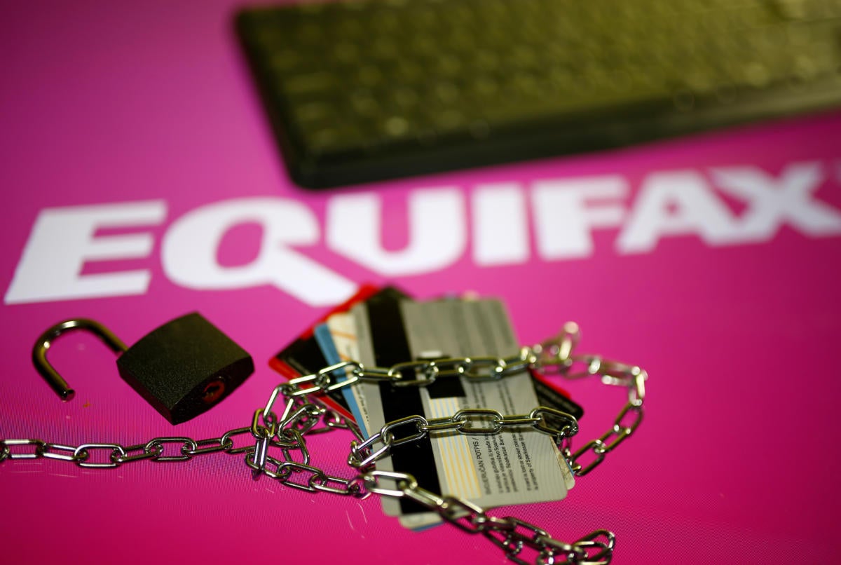 Equifax logo with keyboard lock and credit cards