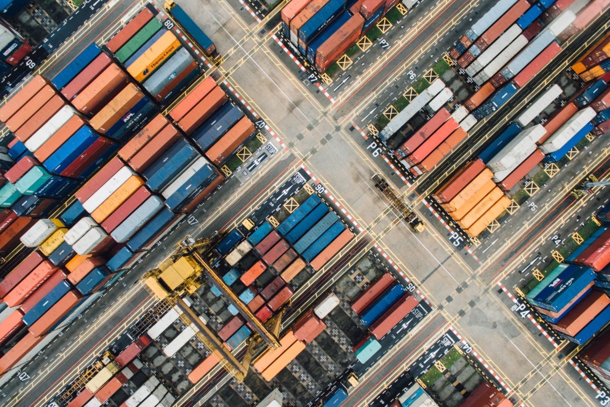 aerial view of shipping containers [by StockSnap - CC0 via Pixabay]