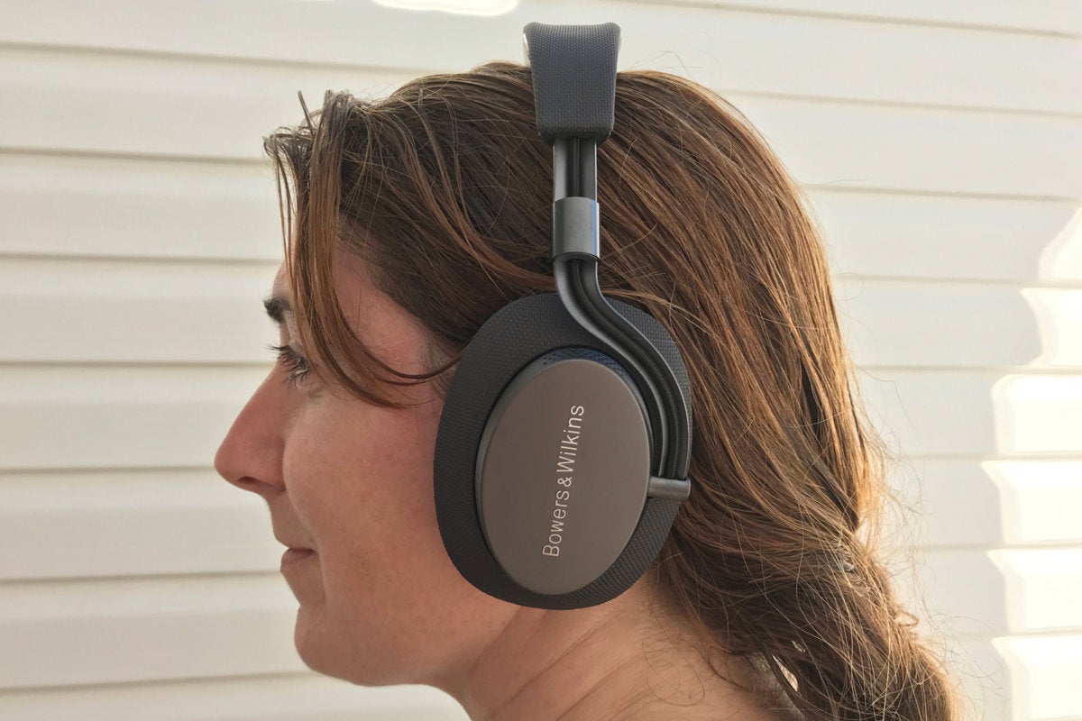 Woman wearing B&W PX headphones