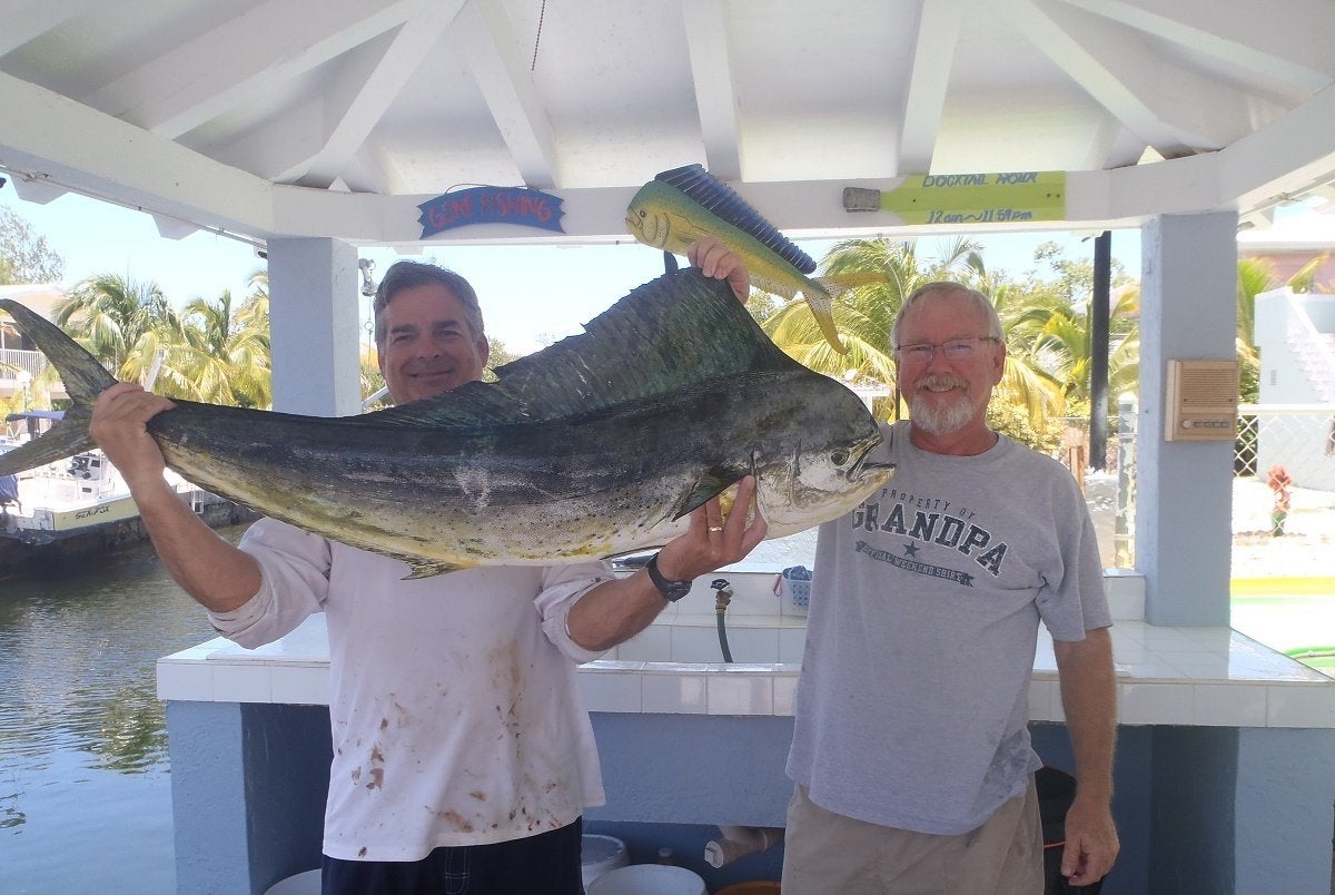 fishermen holding big fish