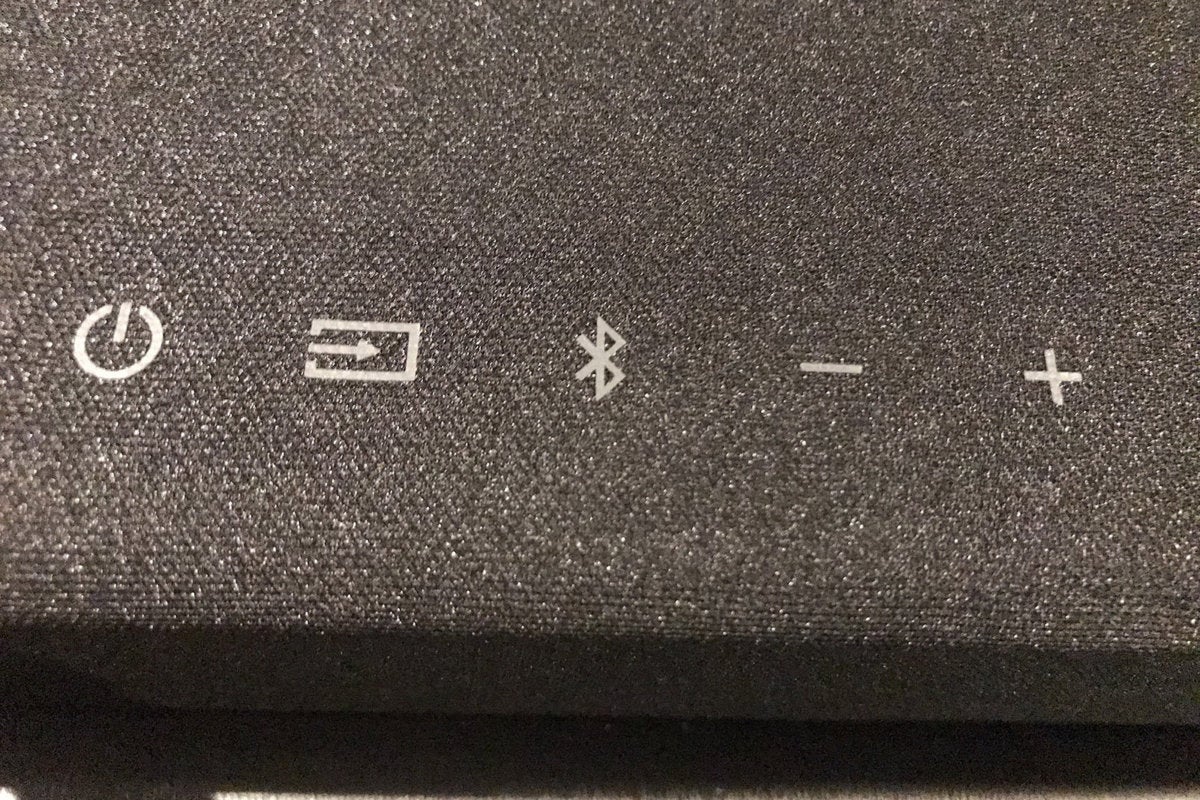 The top of the sound bar has basic, functional buttons.