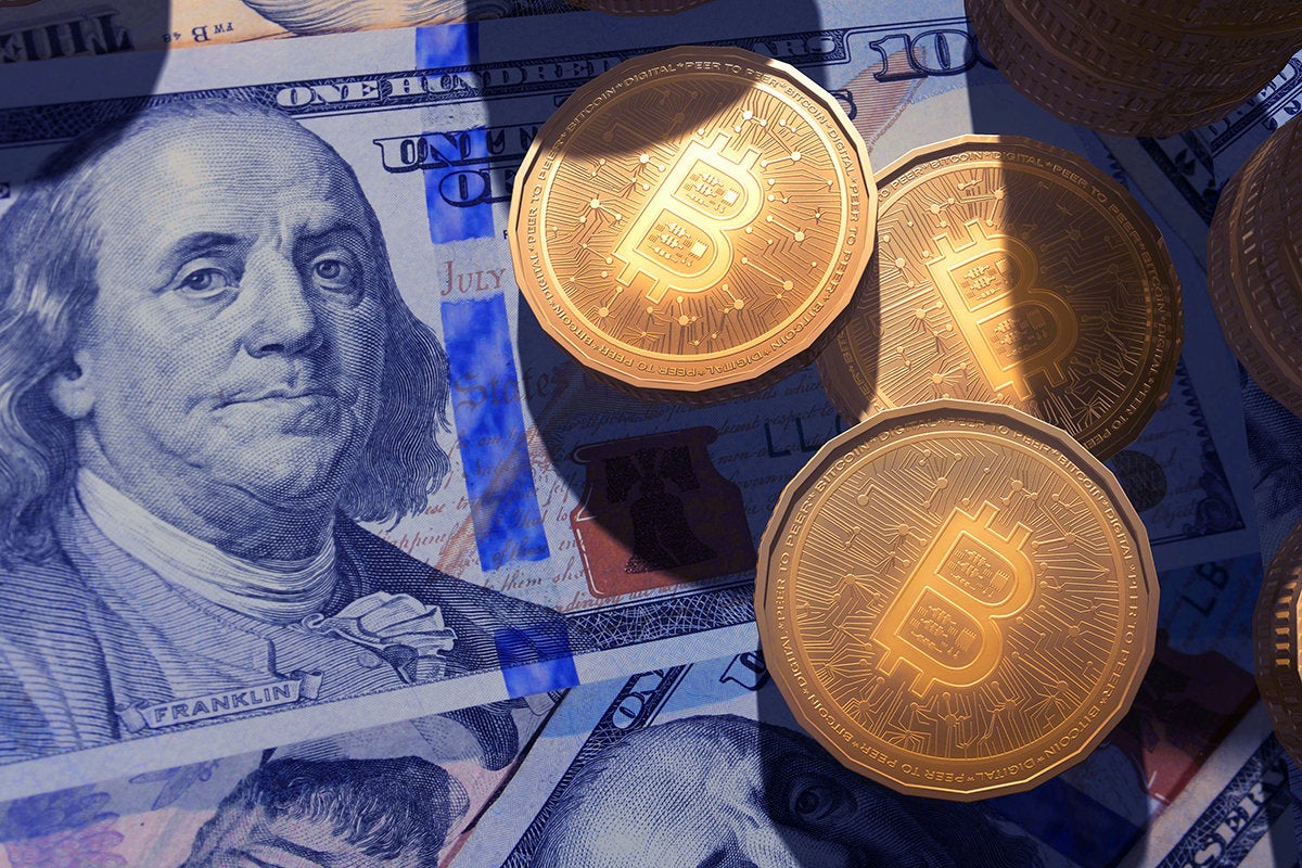 bitcoins and dollar bills