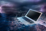 laptop adrift on a stormy ocean