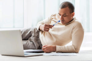 Guy looking at laptop