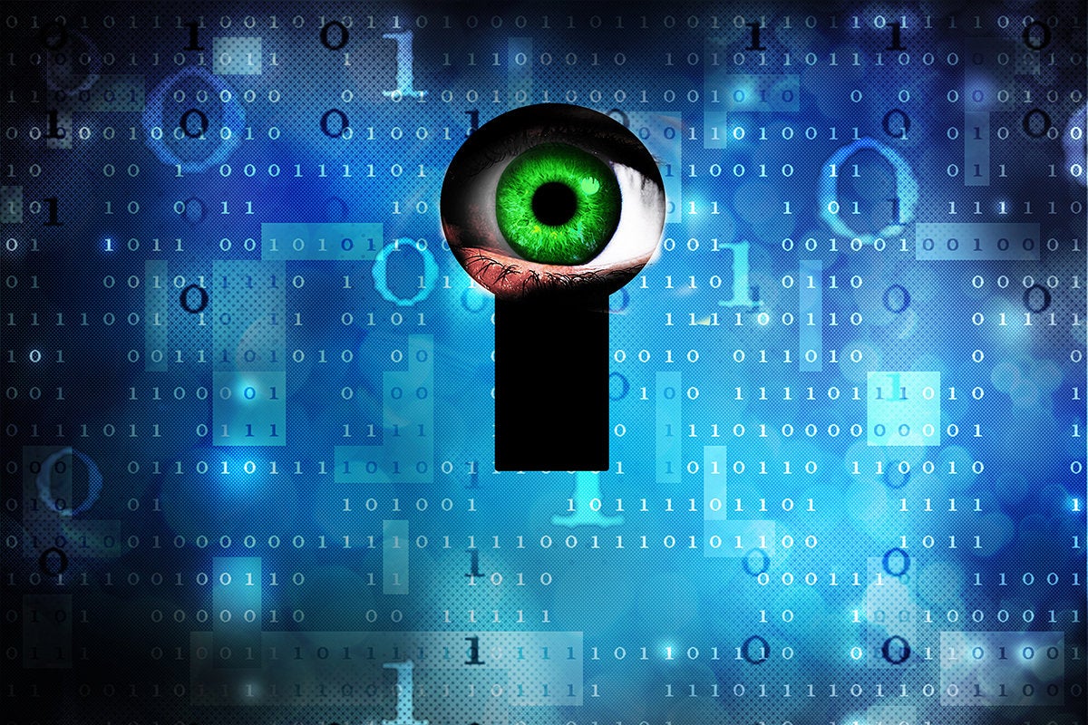 privacy breach - surveilling eye at a digital keyhole in a binary wall