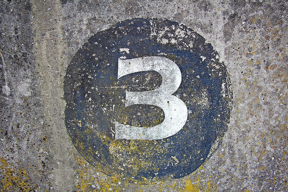 number three painted on concrete