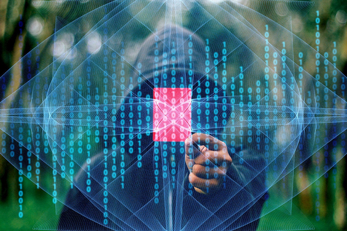 a hooded figure targets a coding vulnerability