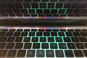 MacBook laptop keyboard close-up with reflection