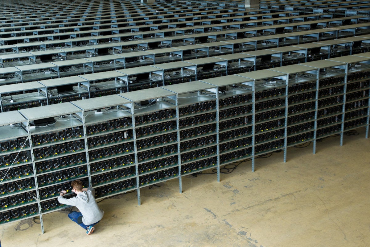 technician maintains bitcoin mining rigs in kncminer's data