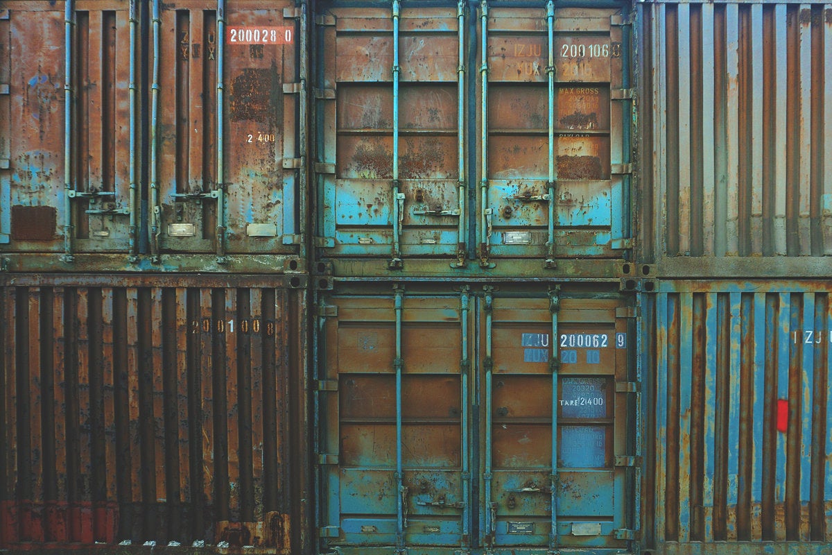 containers rust storage compartment shipping crates blue by boba jovanovic via unsplash