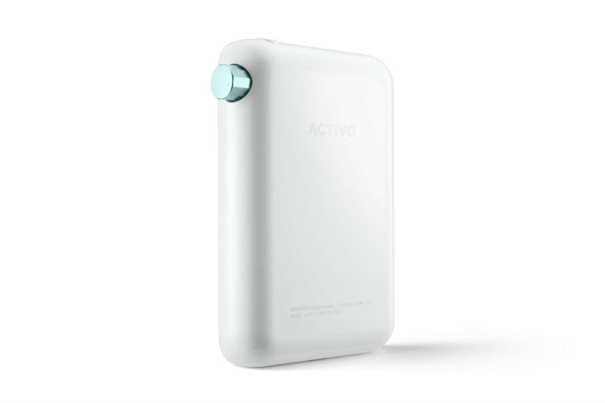The player has a white polycarbonate back and mint-green colored volume dial.