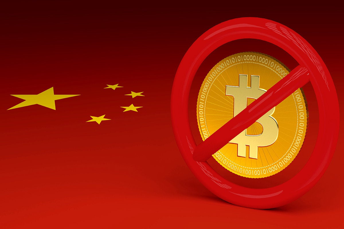 Bitcoin banned against a Chinese flag.