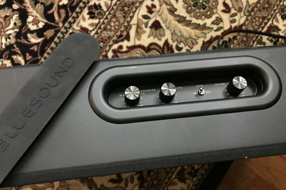The Pulse Subwoofer’s fine-tune controls are located under a rubber cover on the subwoofer’s top.