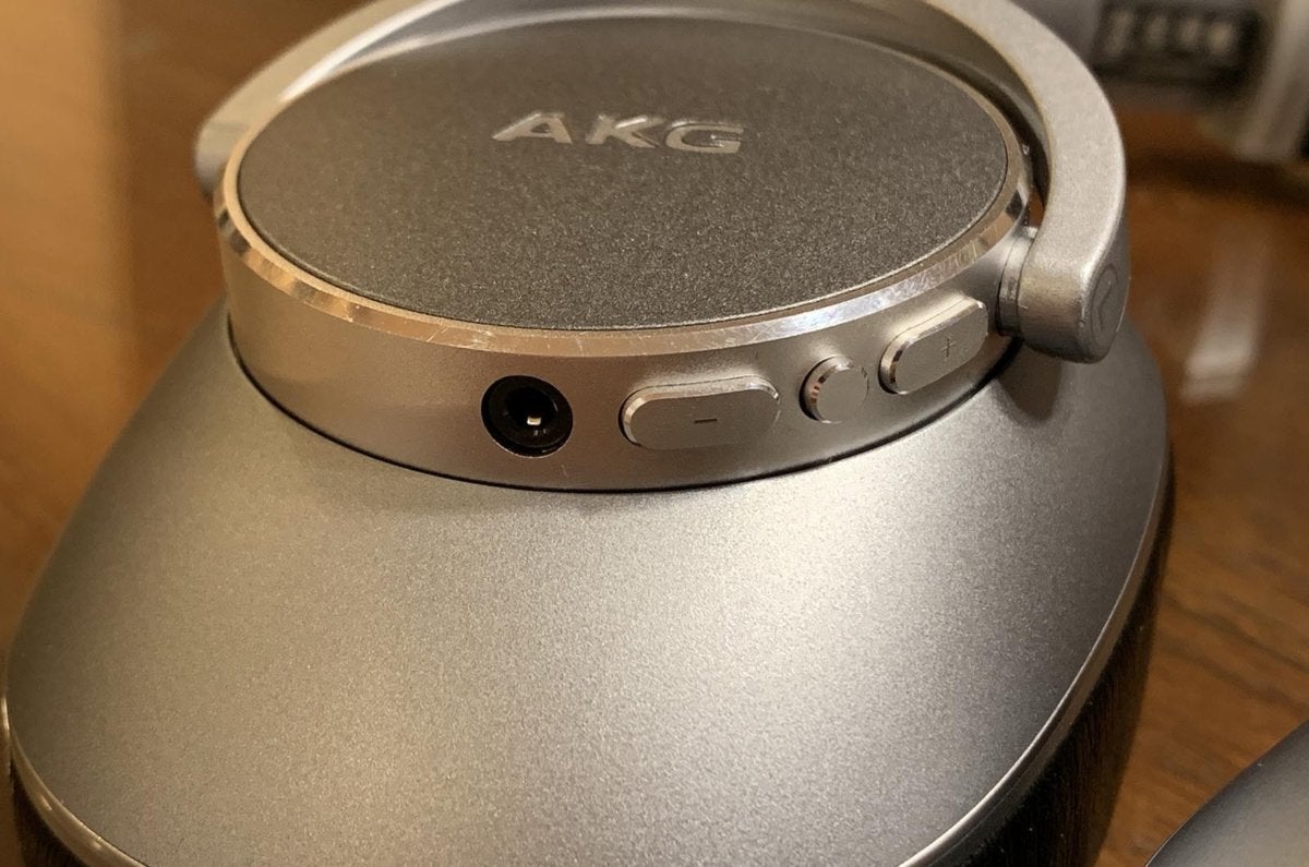 Detail view of the volume controls on the left ear cup.