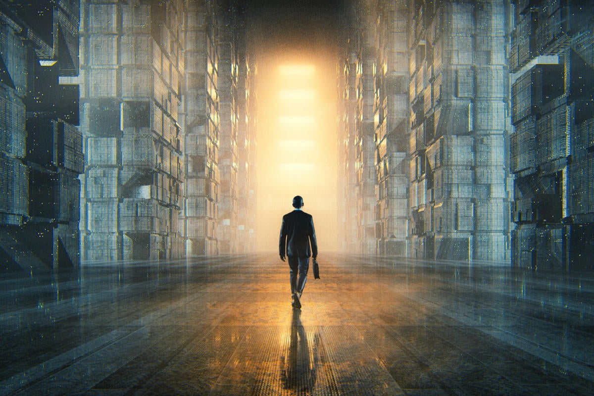 A businessman walks through futuristic data repository.