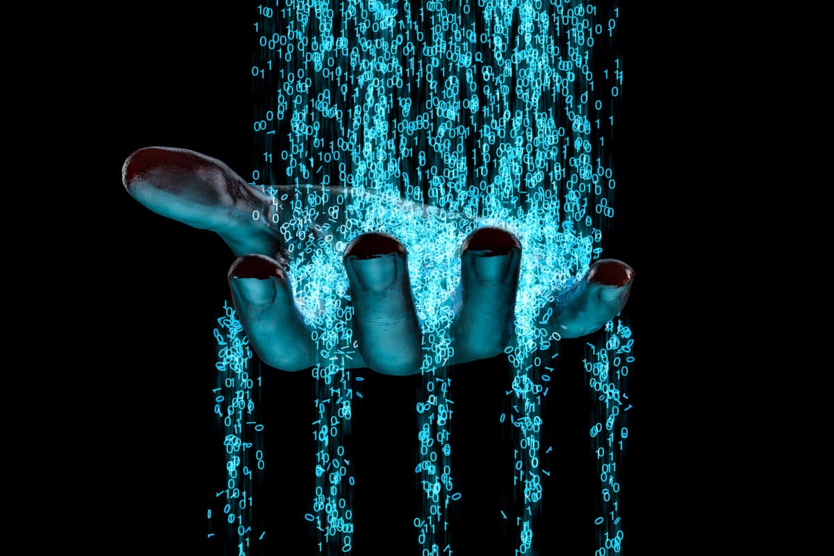 Binary stream flowing through the fingers and palm of an upturned hand.