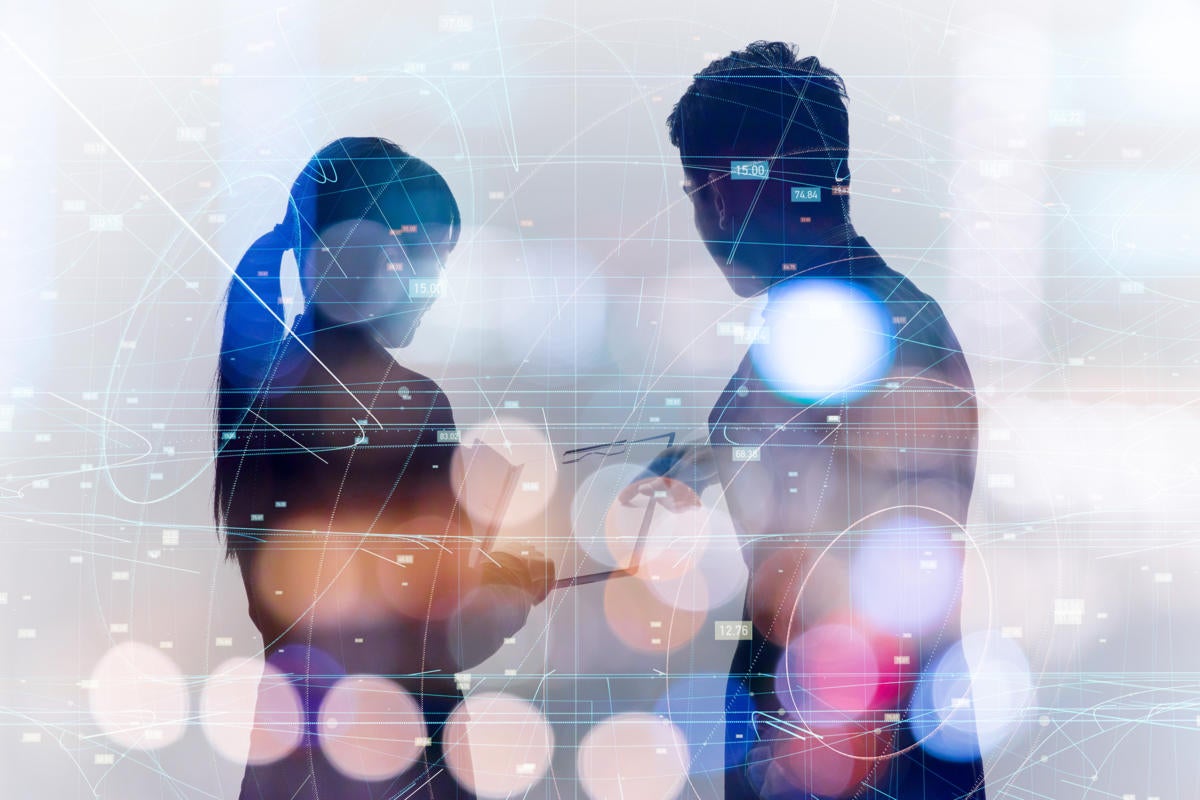 Double-exposure combining silhouettes of collaborating professionals with statistical data.