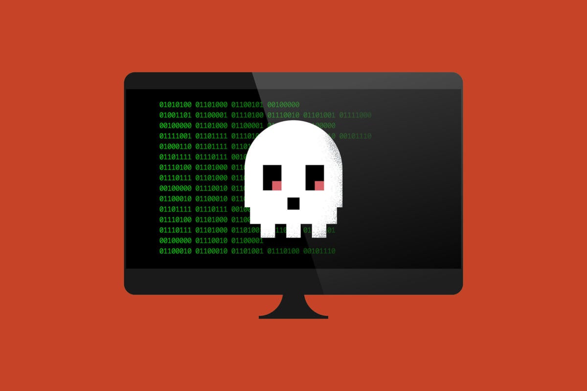 A computer monitor displays code and a pixelated skull.