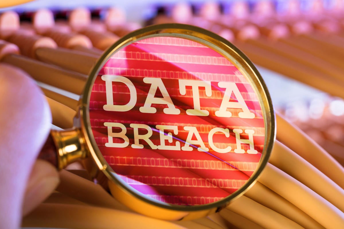 Networking cables viewed through a magnifying lens reveal a data breach.