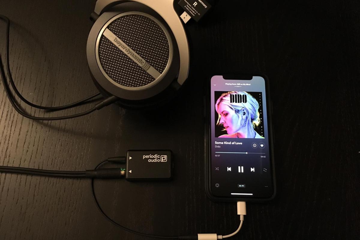 Periodic Audio’s Nickel amplifier is about the size of a 9-volt battery and seen here with an iPhone