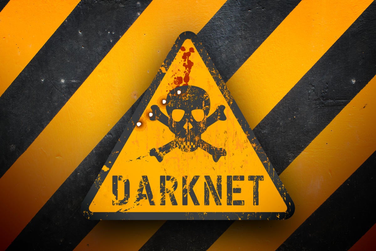 Dark net warning sign against black and yellow warning stripes in the background.