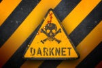Dark net warning sign against black and yellow warning stripes in the background.