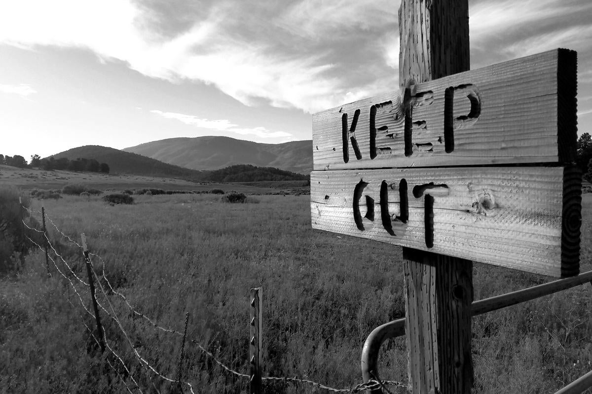 keep out sign do not tresspass privacy authentication access barbed wire by tim husser getty