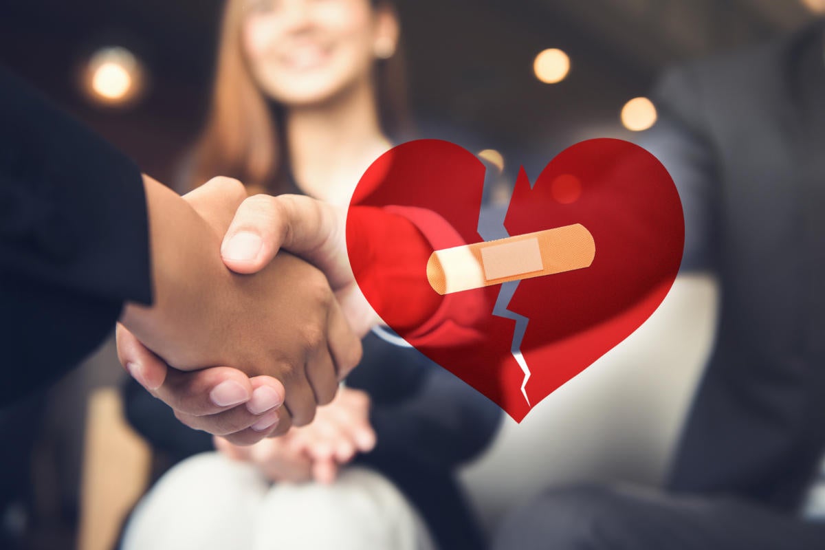 mended relationship / handshake and bandaged heart