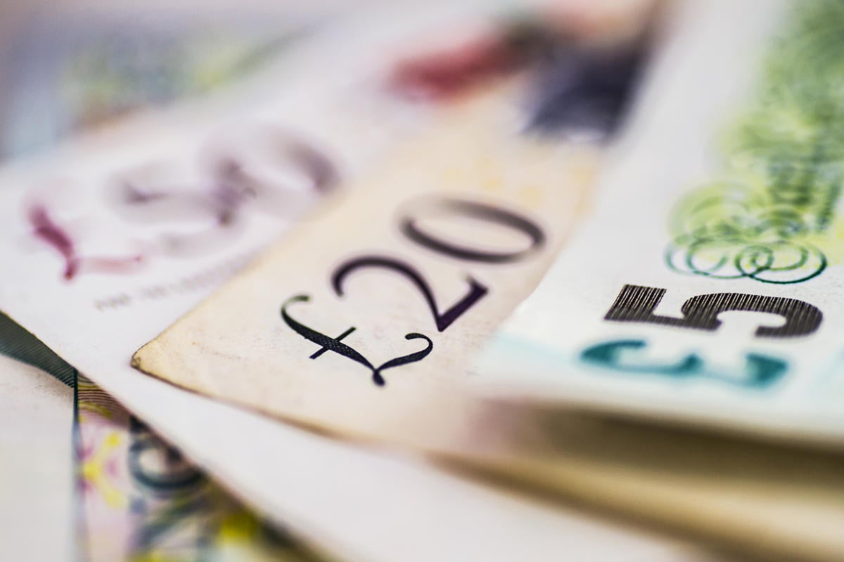 British pound banknotes + coins / currency / money