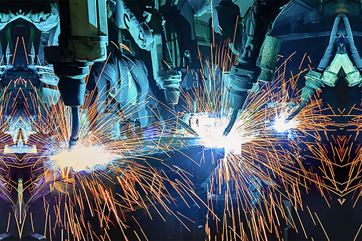 Automation  >  A team of robotic arms welding components.
