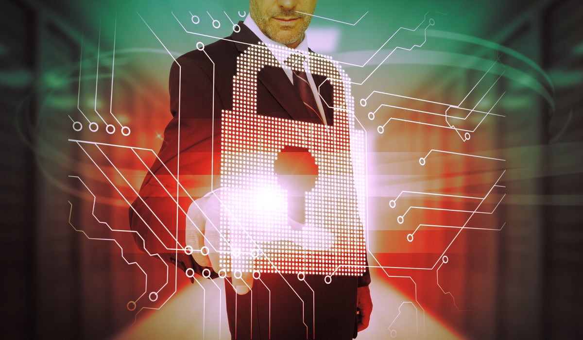 A business man touches a futuristic lock + circuit board security interface.
