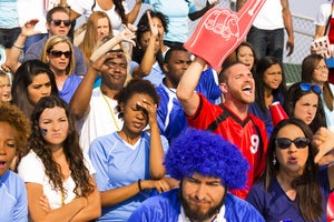 sports one fan cheers the opposing team by fstop123 gettyimages 471924821
