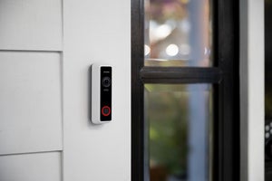 close up of an installed illuminated vivint doorbell camera pro