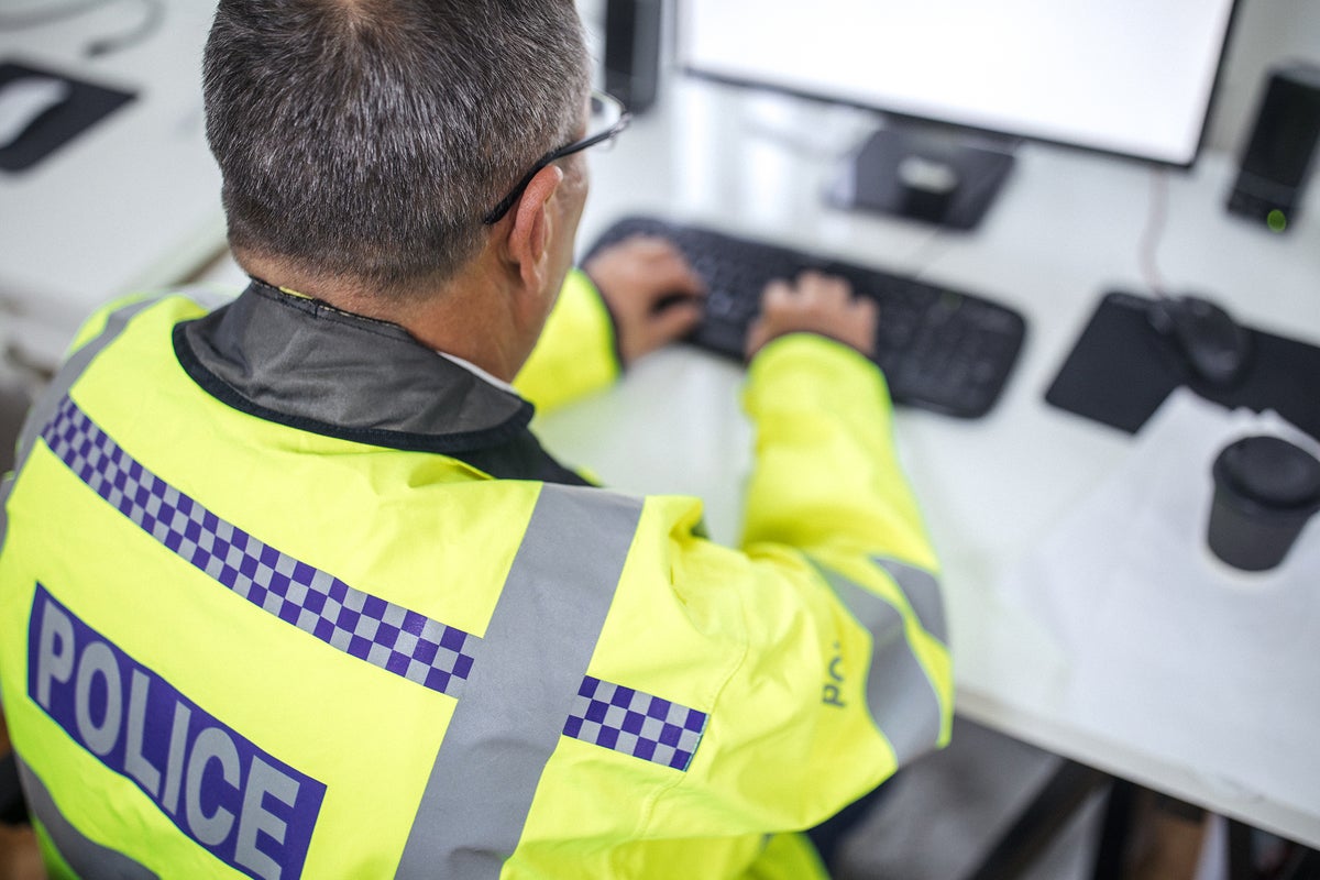 United Kingdom / UK police officer using a computer, targeting cybercrime