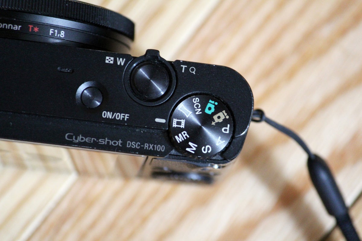Close up of toggle switch for the Sony RX100 Mark I's modes