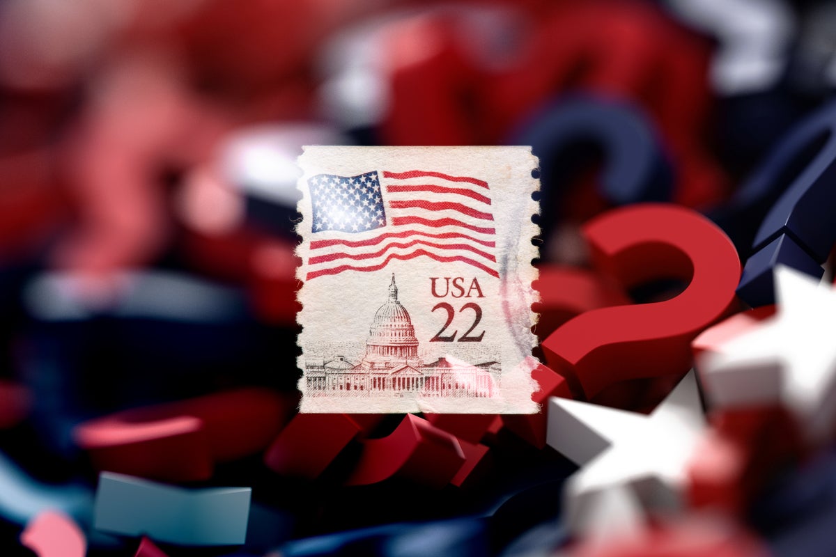 A United States postage stamp displayed against a background of red, white and blue question marks.