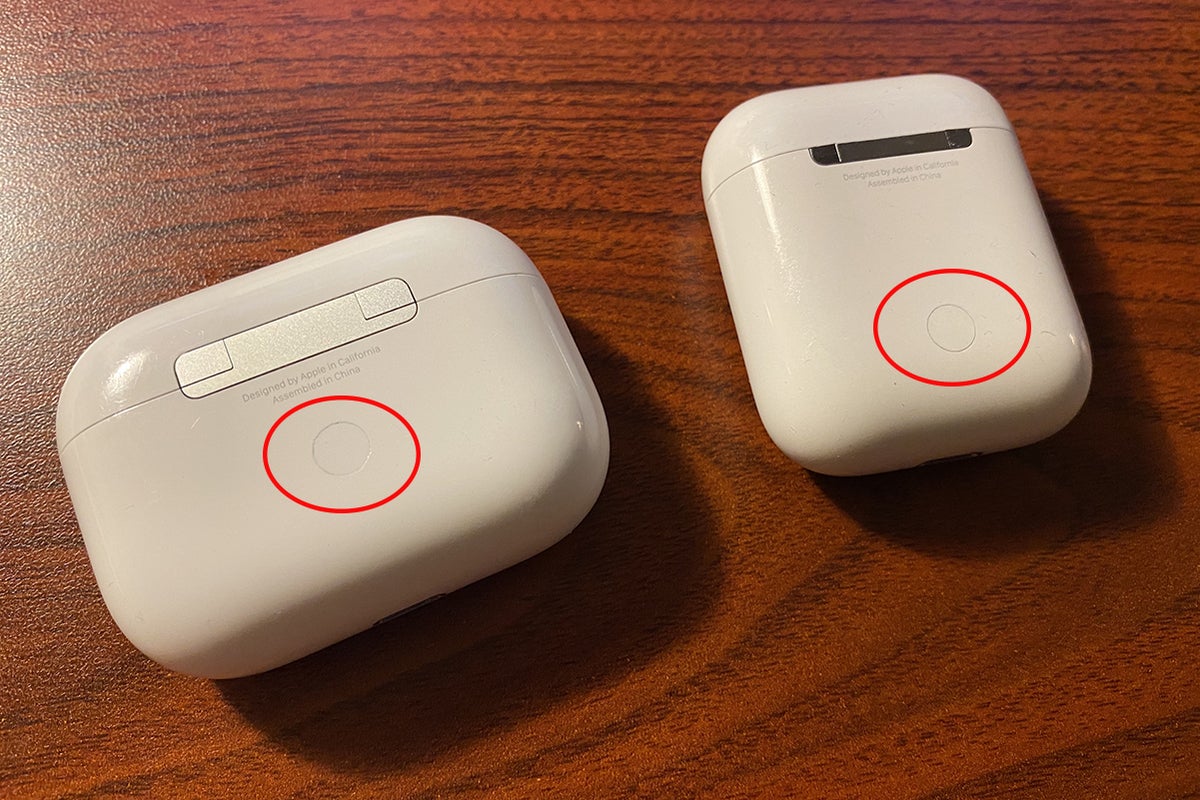 airpods with their pairing buttons highlighted in red