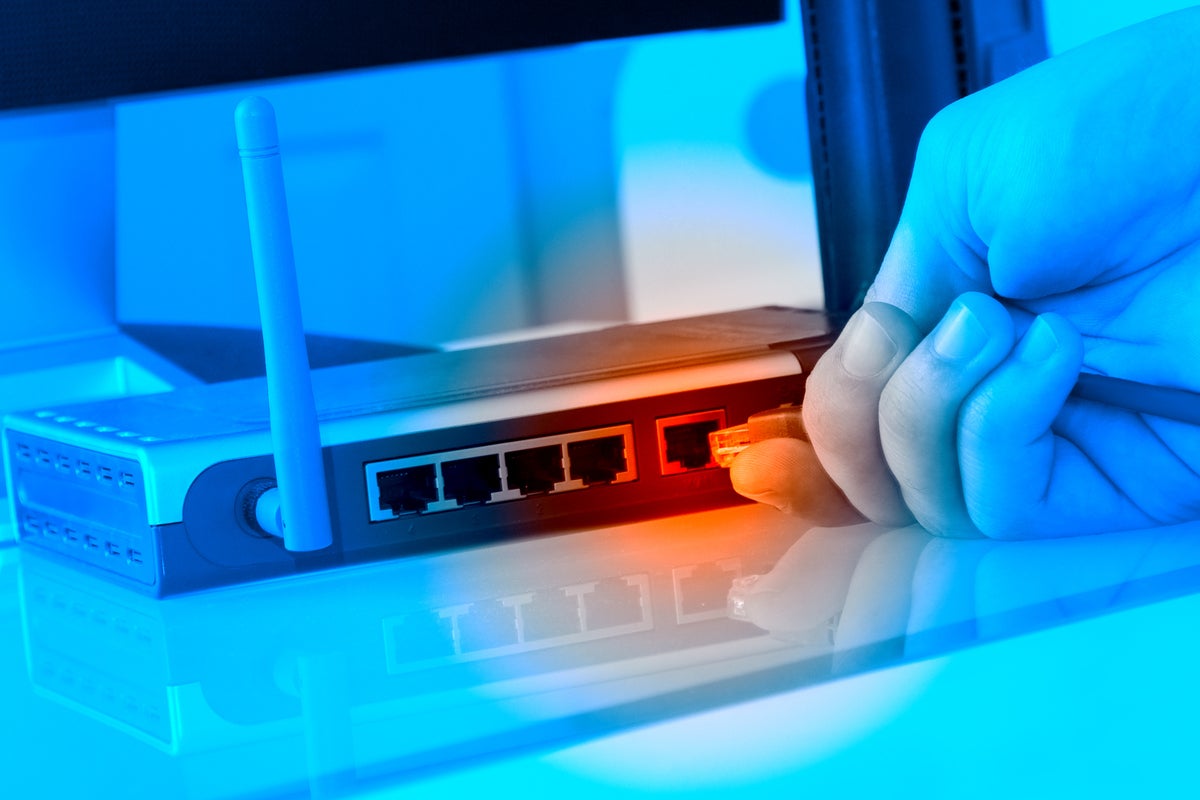nw router with ethernet plug coming out by royalfive  gettyimages 103982623