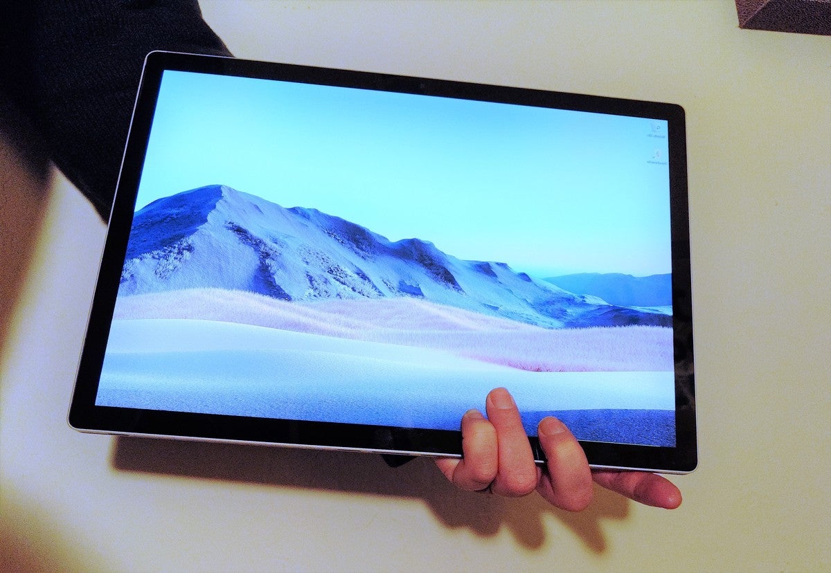 tablet in hand Microsoft Surface Book 3
