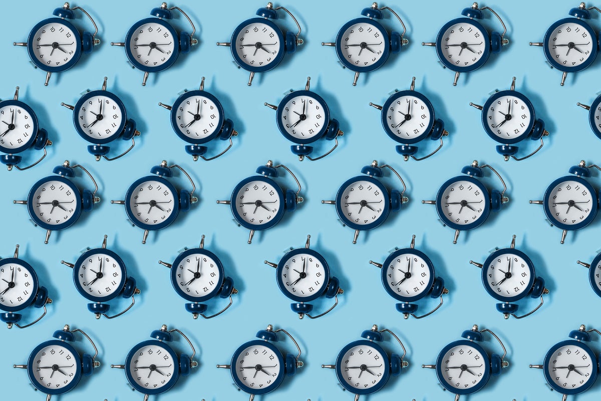 A pattern or grid of alarm clocks.