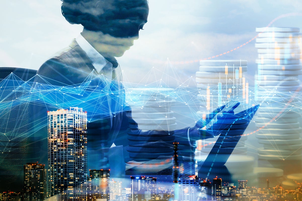 business leadership / double-exposure of a woman with laptop and phone, city skyline + abstract data