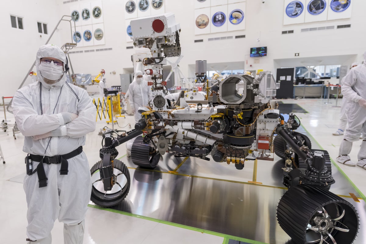 Rieber with Perseverance rover in High-Bay 1 Spacecraft Assembly Facility (SAF) clean room at JPL.