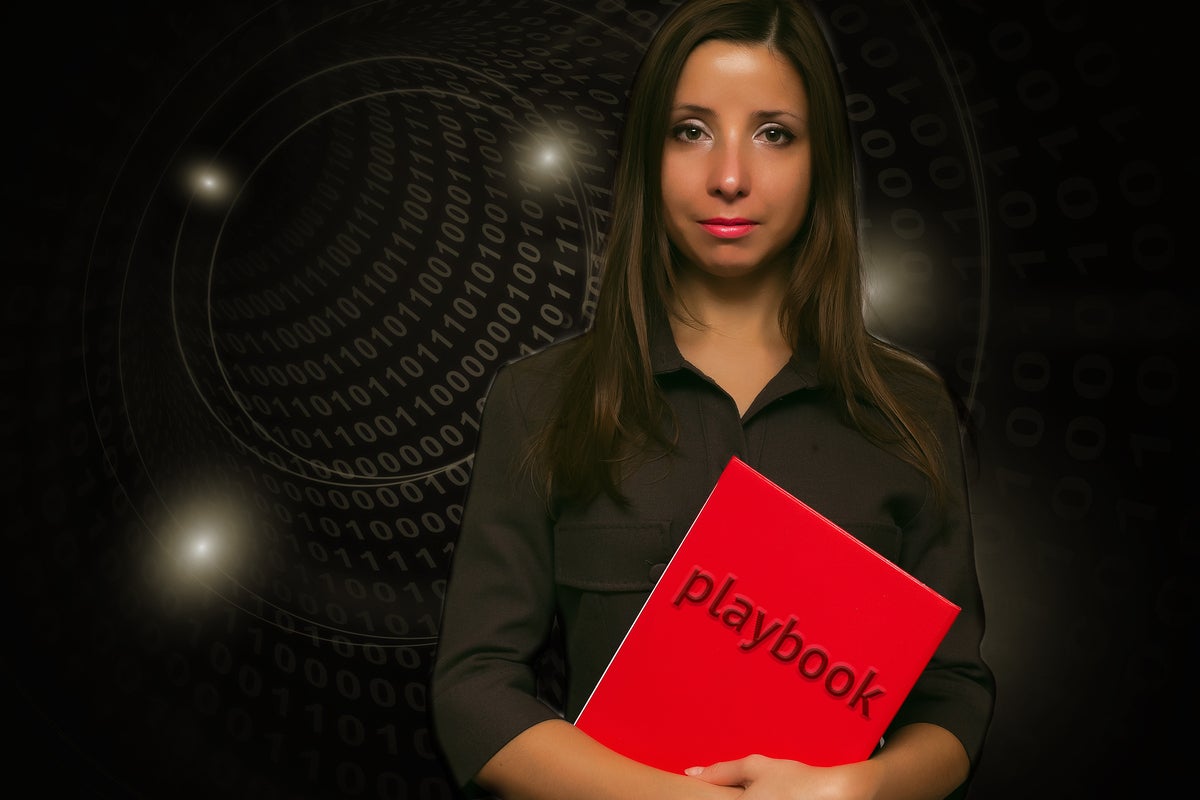 woman holding playbook guide book guide binary by undefined undefined getty images