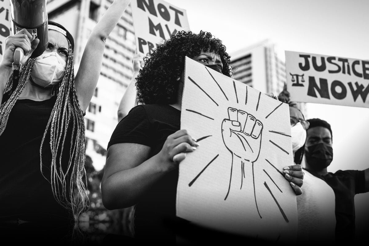 Activists protest against racism and advocate for social justice and equal rights.