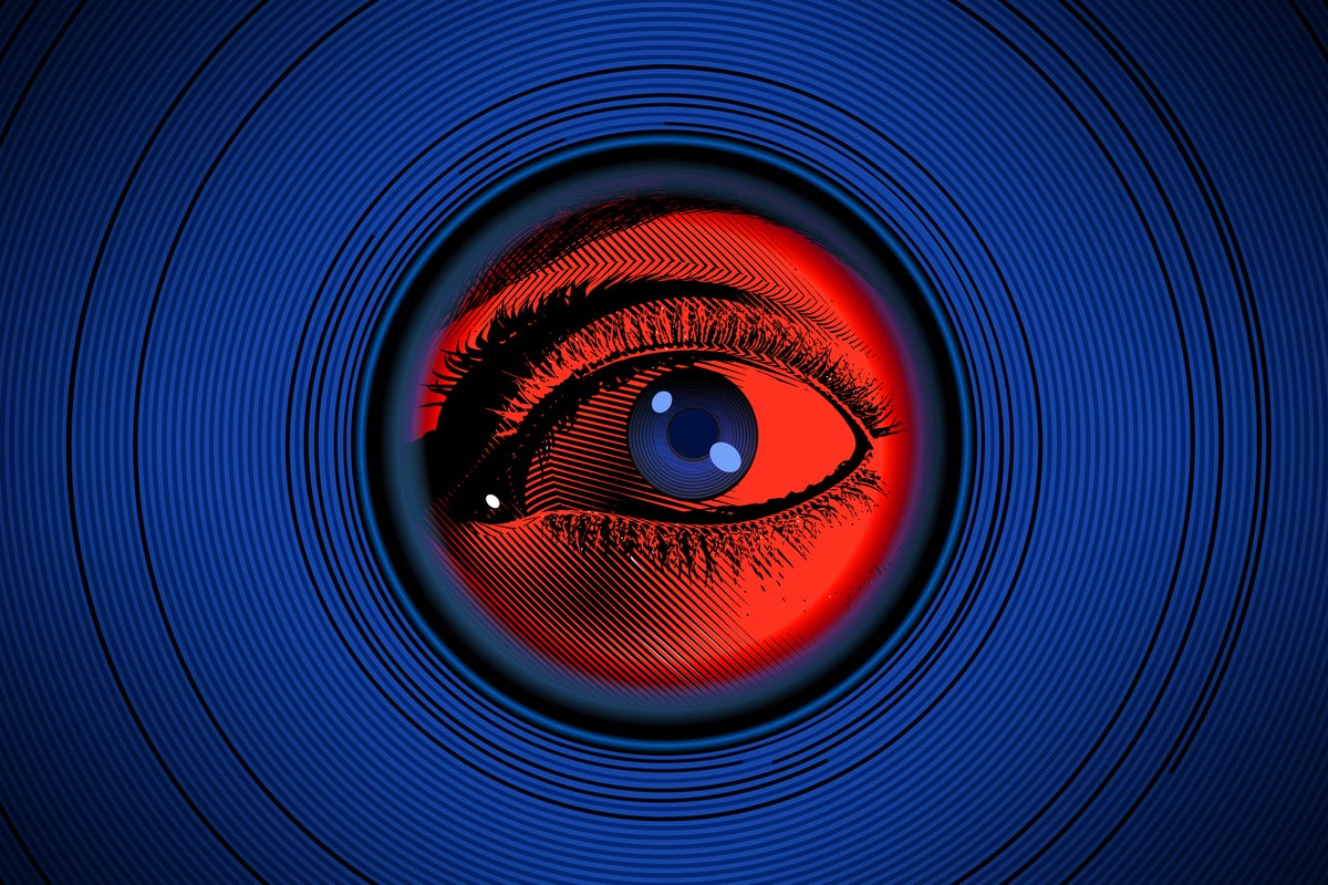 Privacy: An eye looks through peephole.