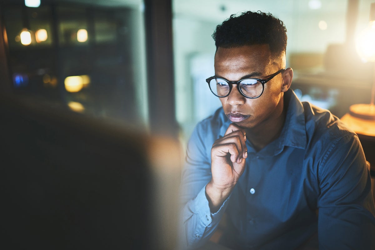 A user in thought rests his chin on his hand. [thinking / consideration / intelligence / planning]