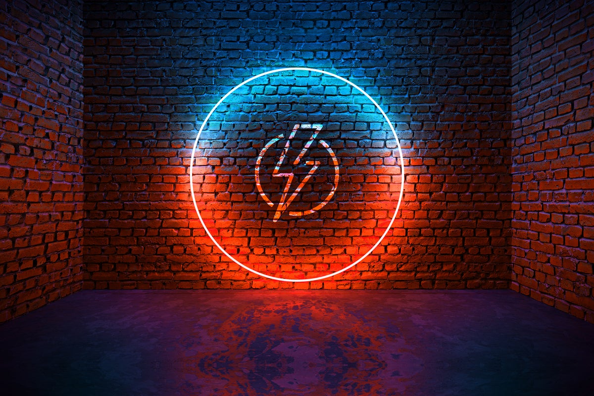Brick walls, one with a glowing neon circle and electricity icon.