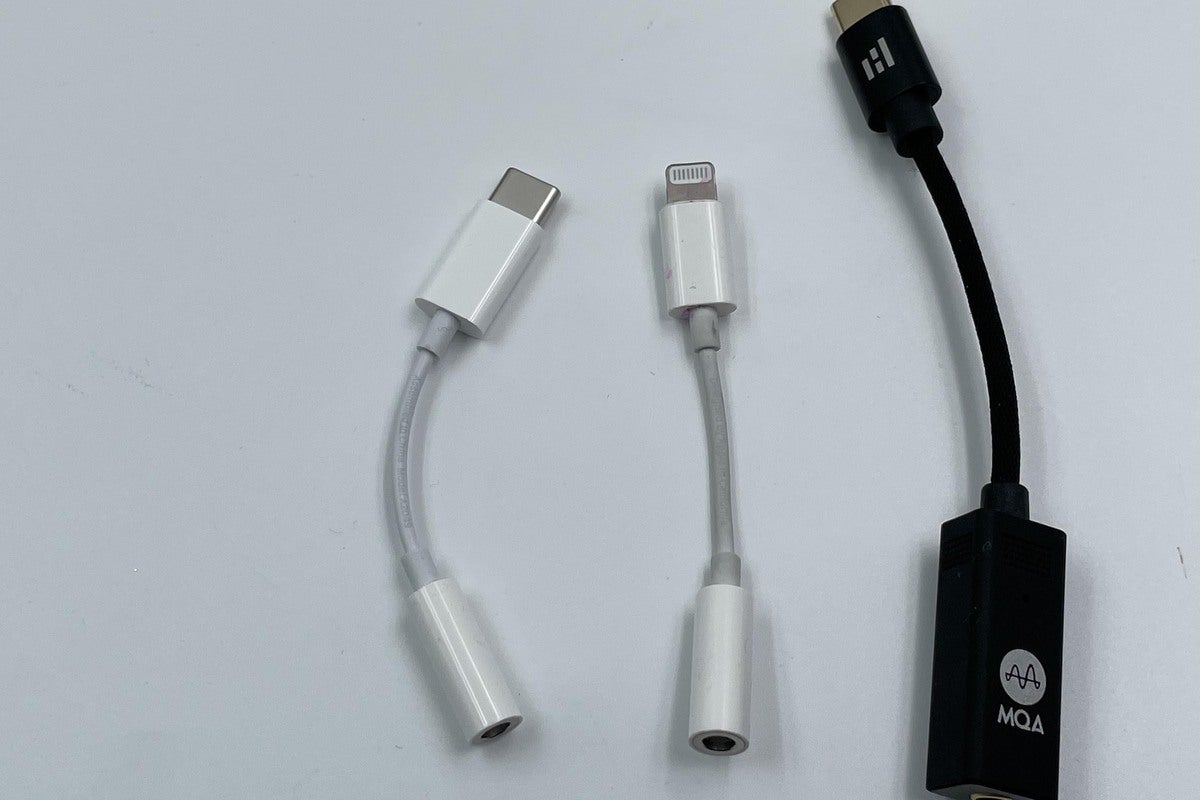 Helm Bolt adapter size compared to Apple’s lightning to headphone adapter and USB-C to headphone ada